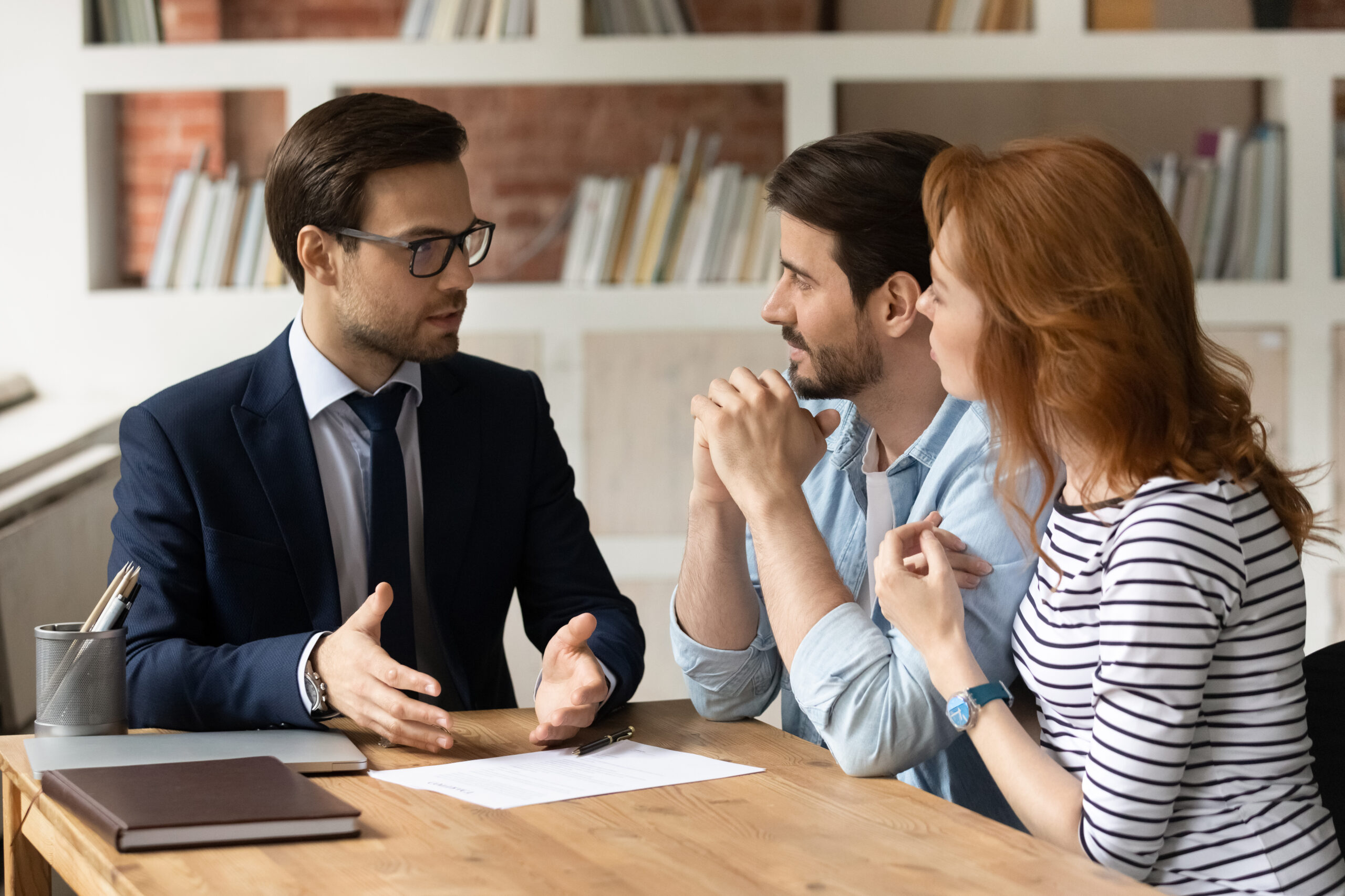 A sales rep teaching strategies to two colleagues